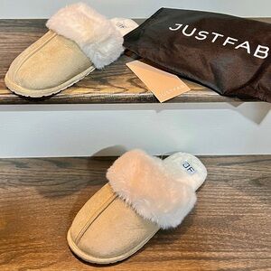 Tan faux fur slippers with dust bag.
